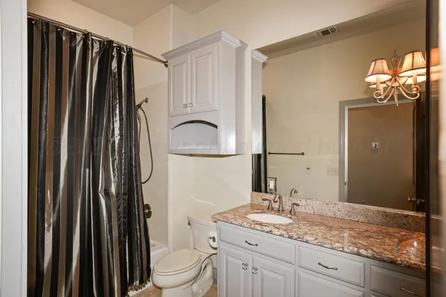 a view of a chair and table in front of a house