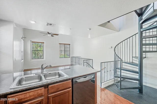 a kitchen with a sink and a refrigerator