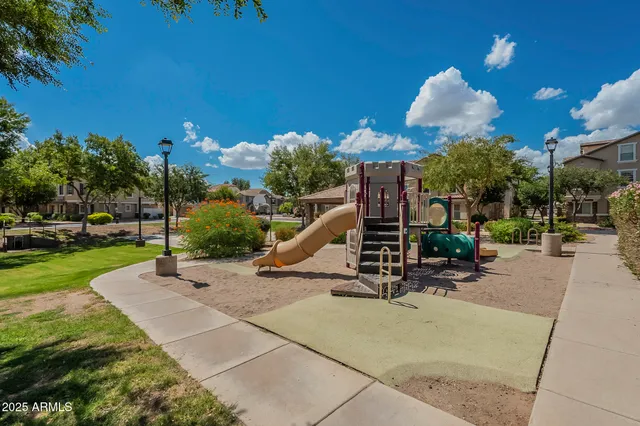 a view of a park with swings and slides