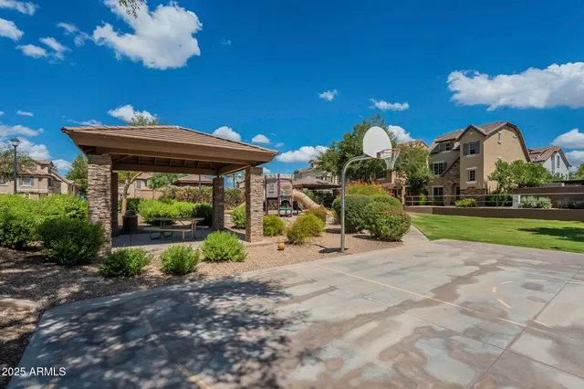 a view of a house with a fountain in a yard