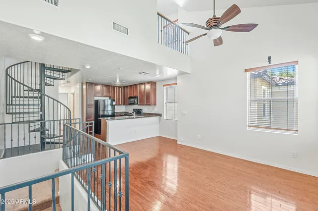 a view of a kitchen with furniture and windows