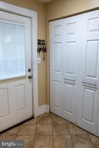a view of a bathroom with closet area