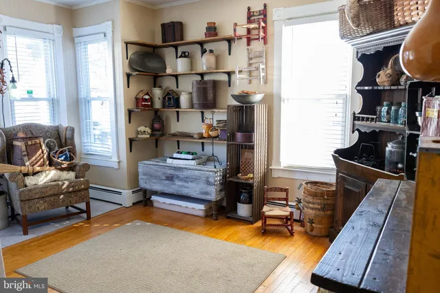 a bedroom with furniture and a rug