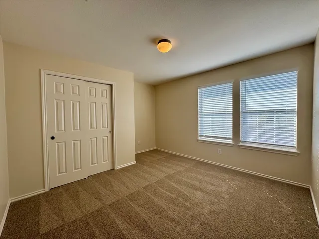 a view of a swimming pool with a yard