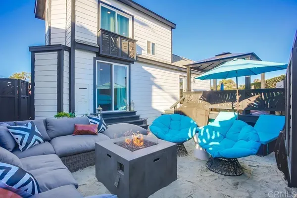 a kitchen with a refrigerator and a dining table