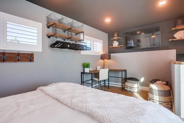 a view of a house with pool and chairs