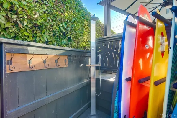 a view of a house with pool and chairs