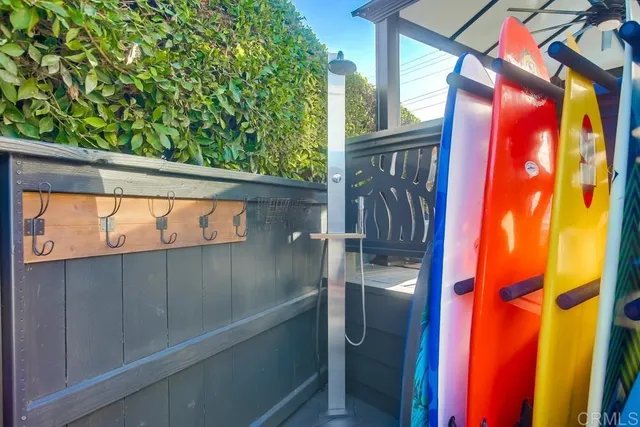 a view of a house with pool and chairs