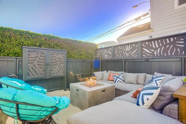 a view of an outdoor space with furniture and umbrella