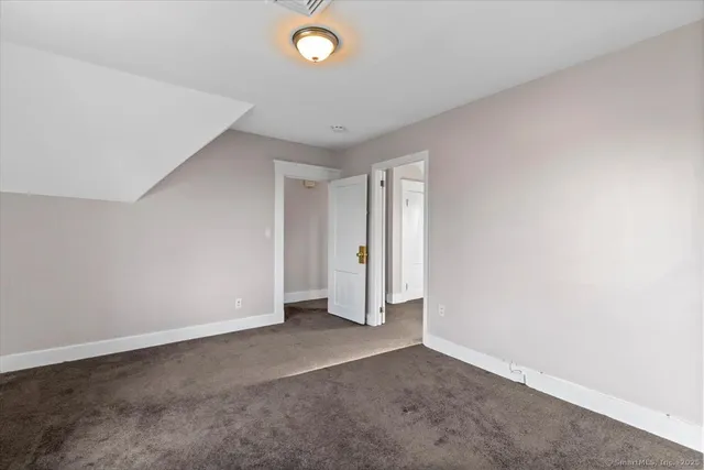 an empty room with a empty space and window