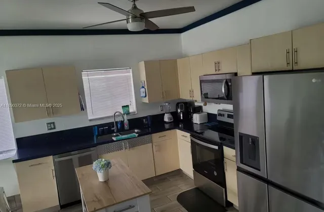 a spacious bedroom with a bed and window