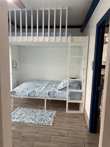 a view of a backyard with plants and swimming pool