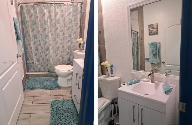 a bathroom with a sink a toilet and shower curtain