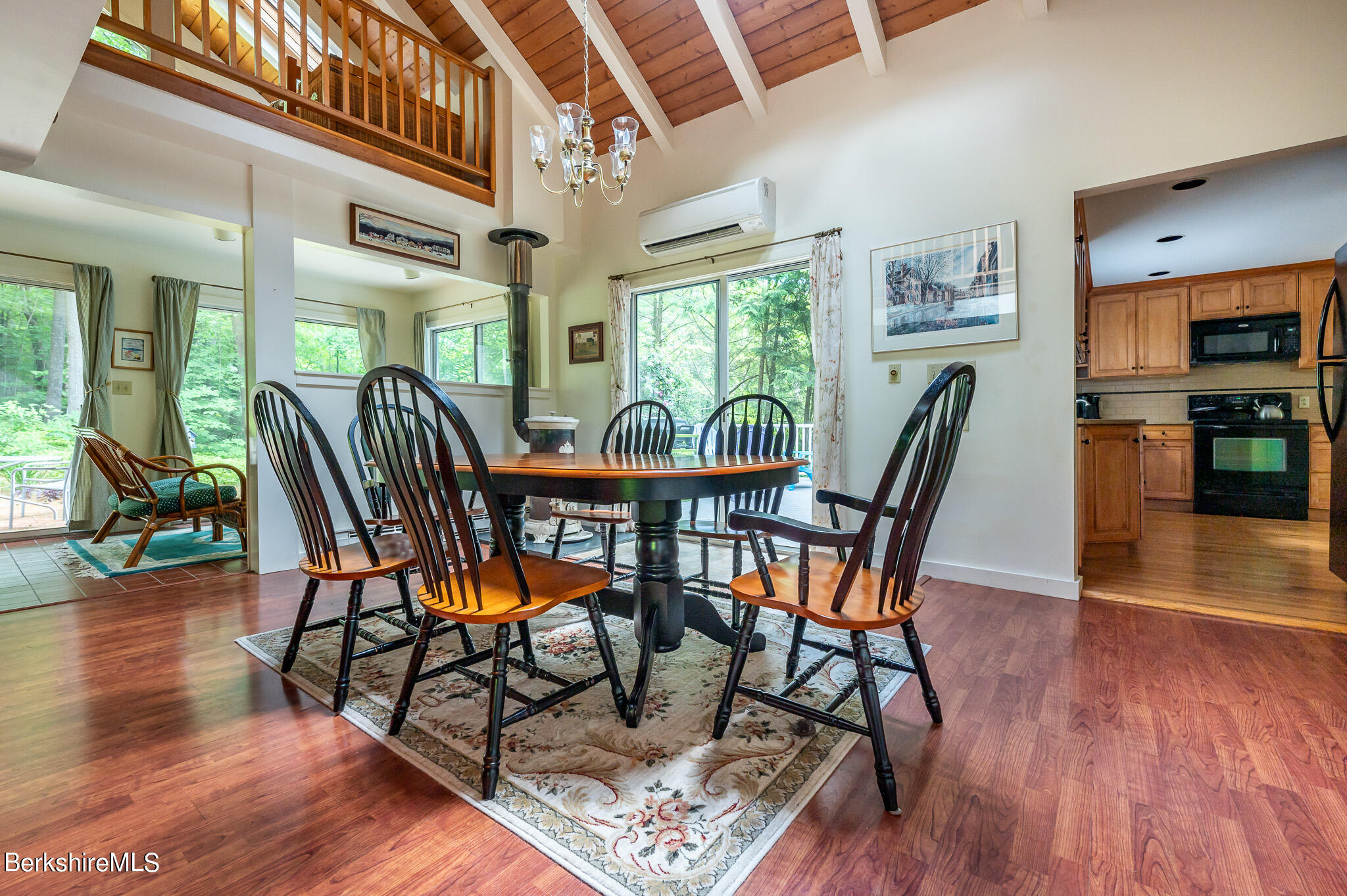 9 Pixley Hill Road West Stockbridge, MA 01236 - Photo 11 of 37 a dining room with furniture a floor to ceiling window and wooden floor