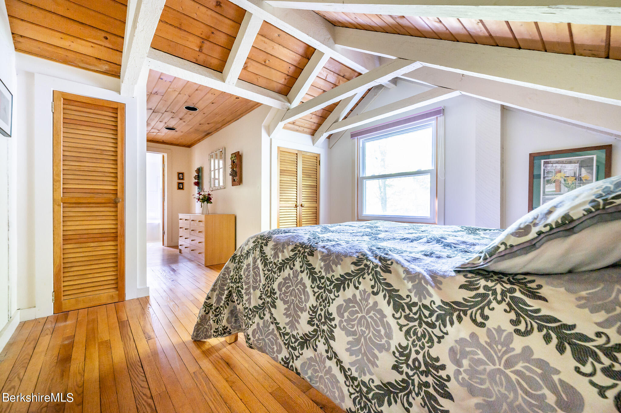 9 Pixley Hill Road West Stockbridge, MA 01236 - Photo 24 of 37 a bedroom with a bed and a wooden floor