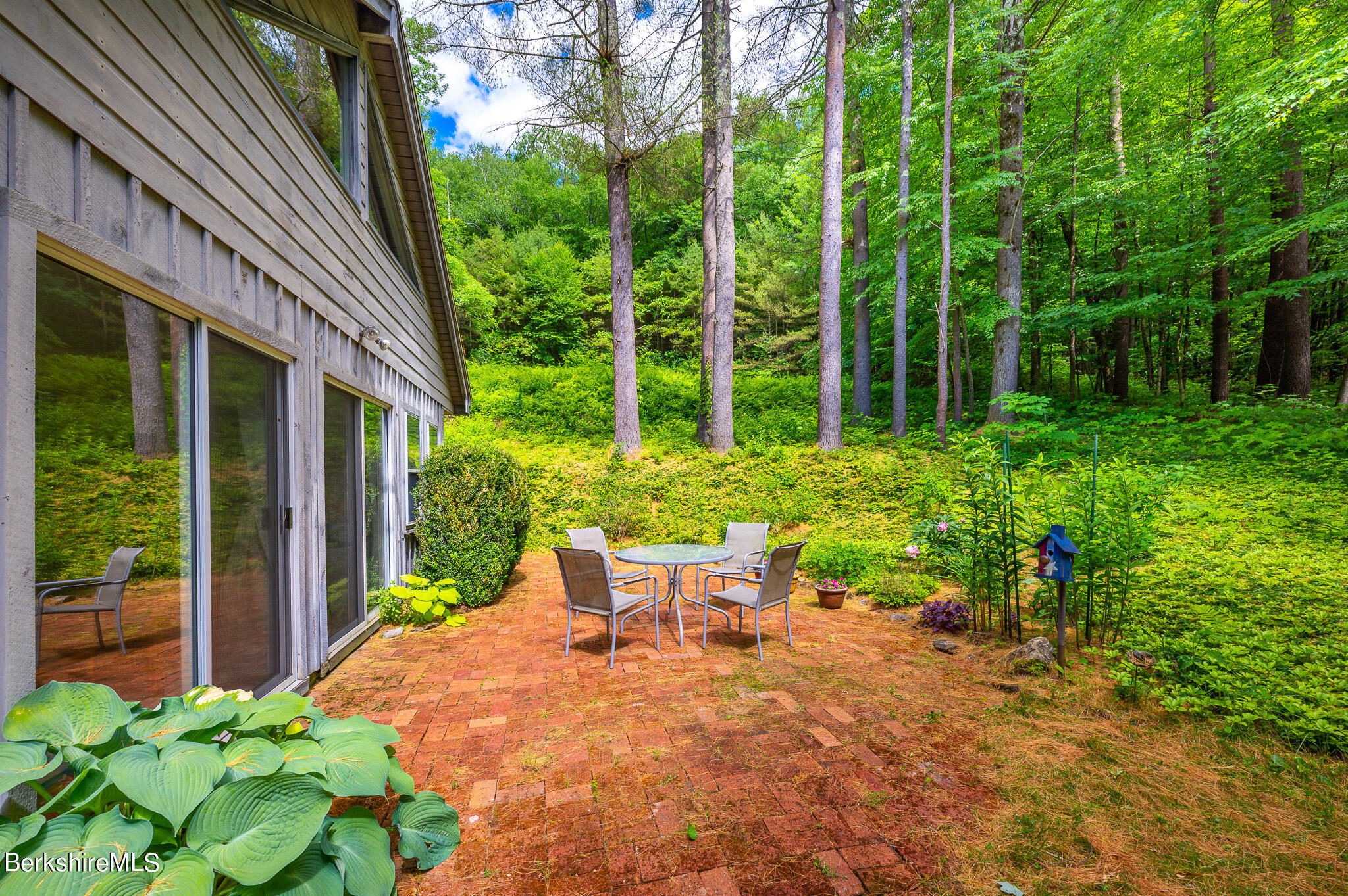 9 Pixley Hill Road West Stockbridge, MA 01236 - Photo 26 of 37 a view of a patio with table and chairs and potted plants