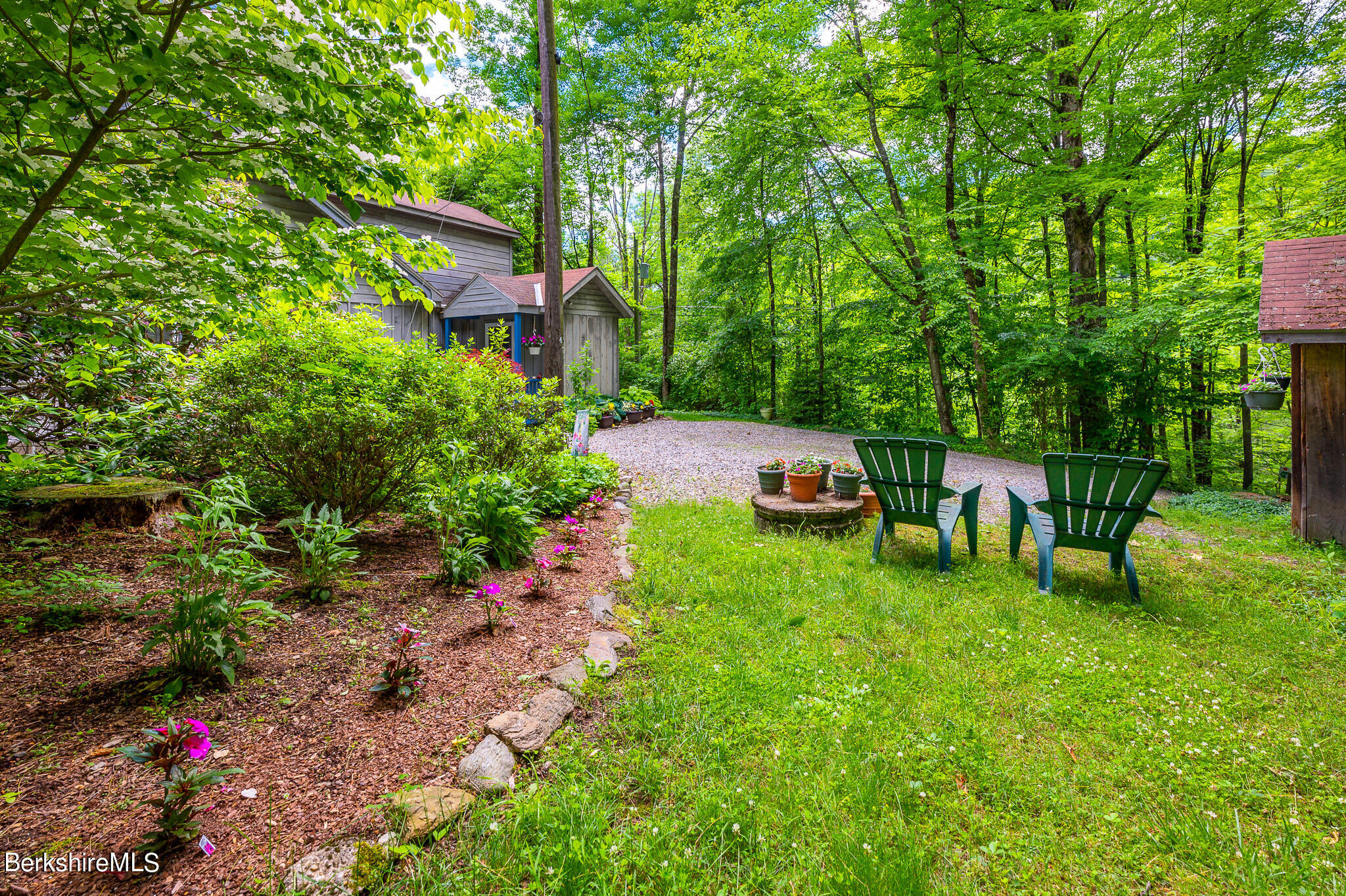 9 Pixley Hill Road West Stockbridge, MA 01236 - Photo 36 of 37 a view of a backyard with table and chairs and potted plants