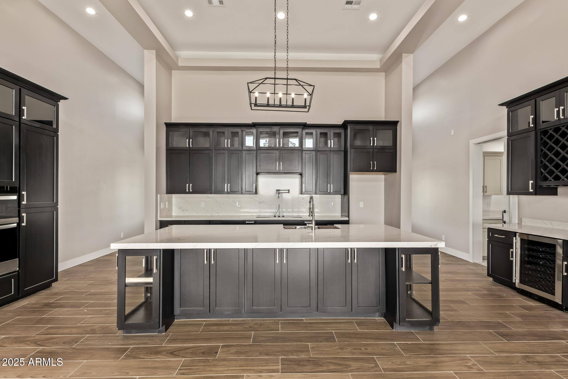 23167 West Montgomery Road Wittmann, AZ 85361 - Photo 12 of 44 a kitchen with stainless steel appliances granite countertop a stove and a refrigerator