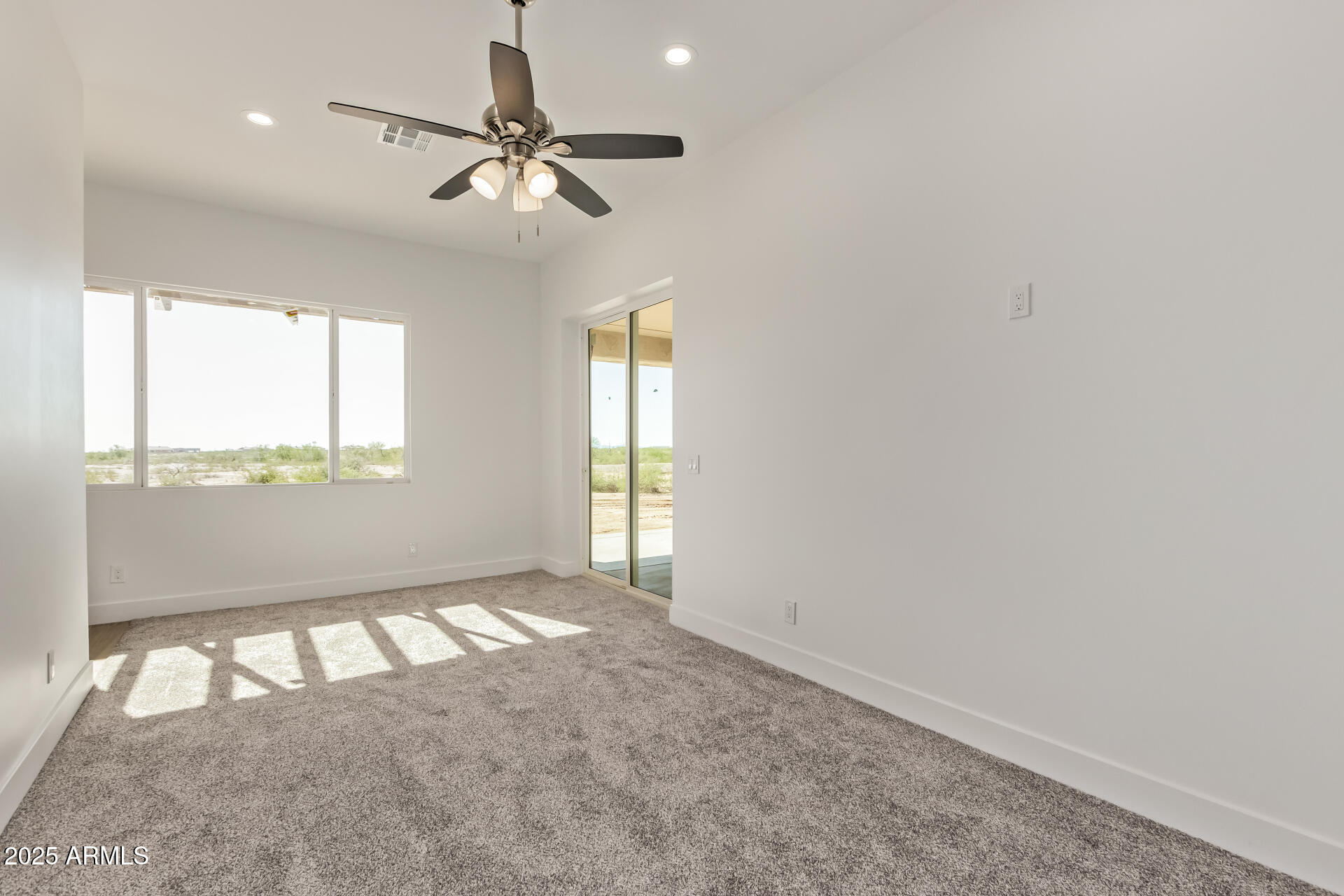 23167 West Montgomery Road Wittmann, AZ 85361 - Photo 15 of 44 a view of an empty room and window