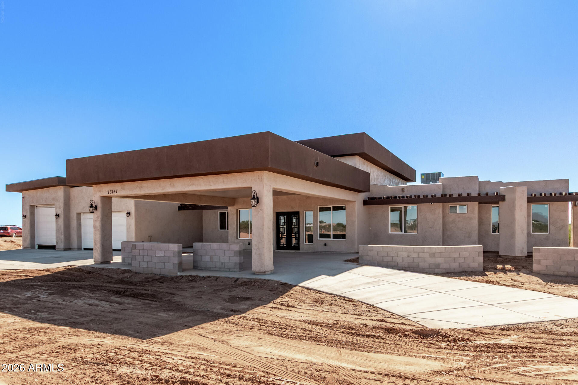 23167 West Montgomery Road Wittmann, AZ 85361 - Photo 41 of 44 a front view of a house