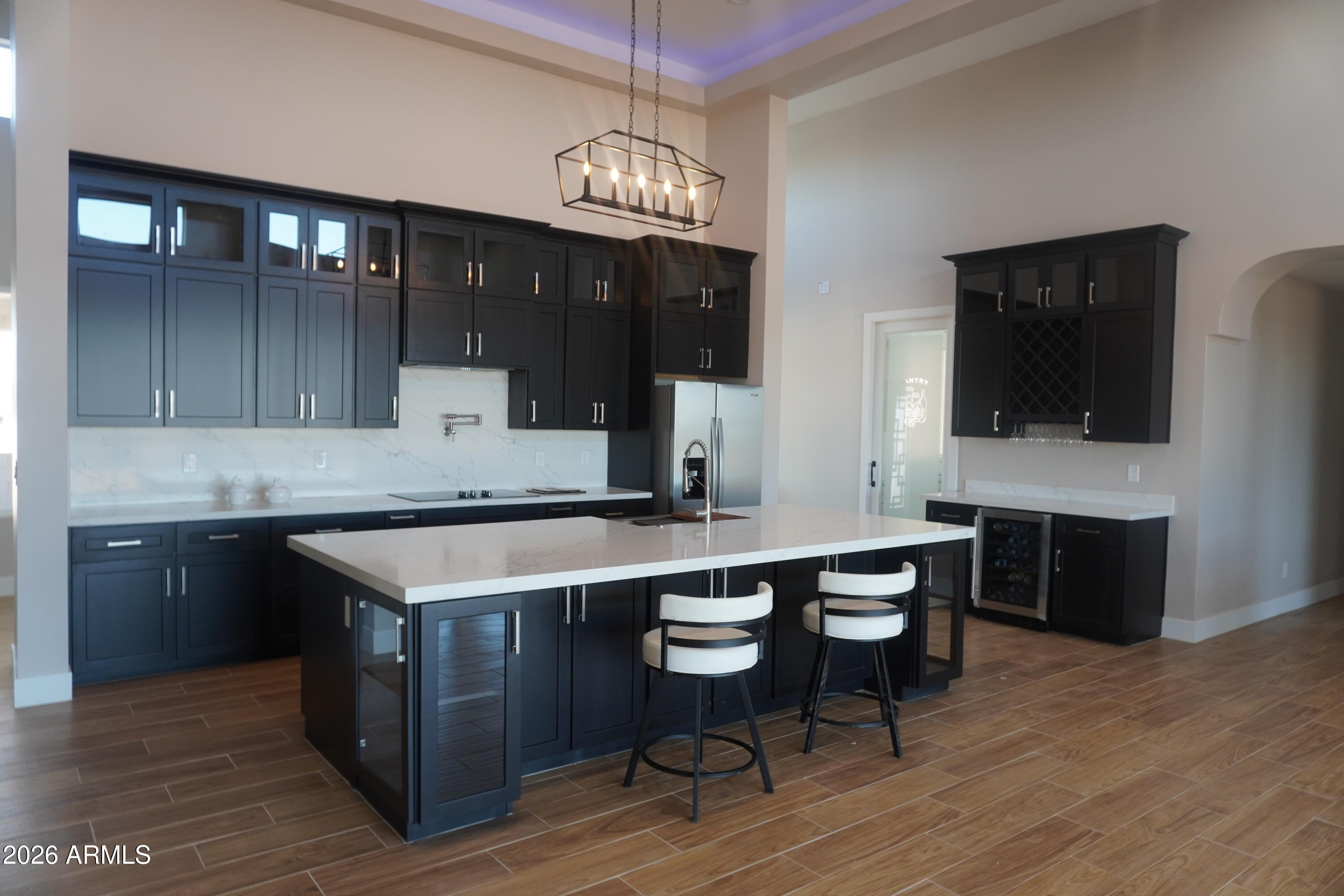23167 West Montgomery Road Wittmann, AZ 85361 - Photo 5 of 44 a kitchen with a counter space cabinets and appliances