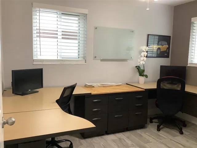 a kitchen with a table and chairs in it