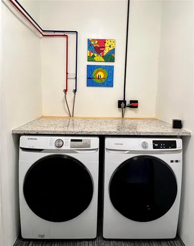 a utility room with dryer and washer