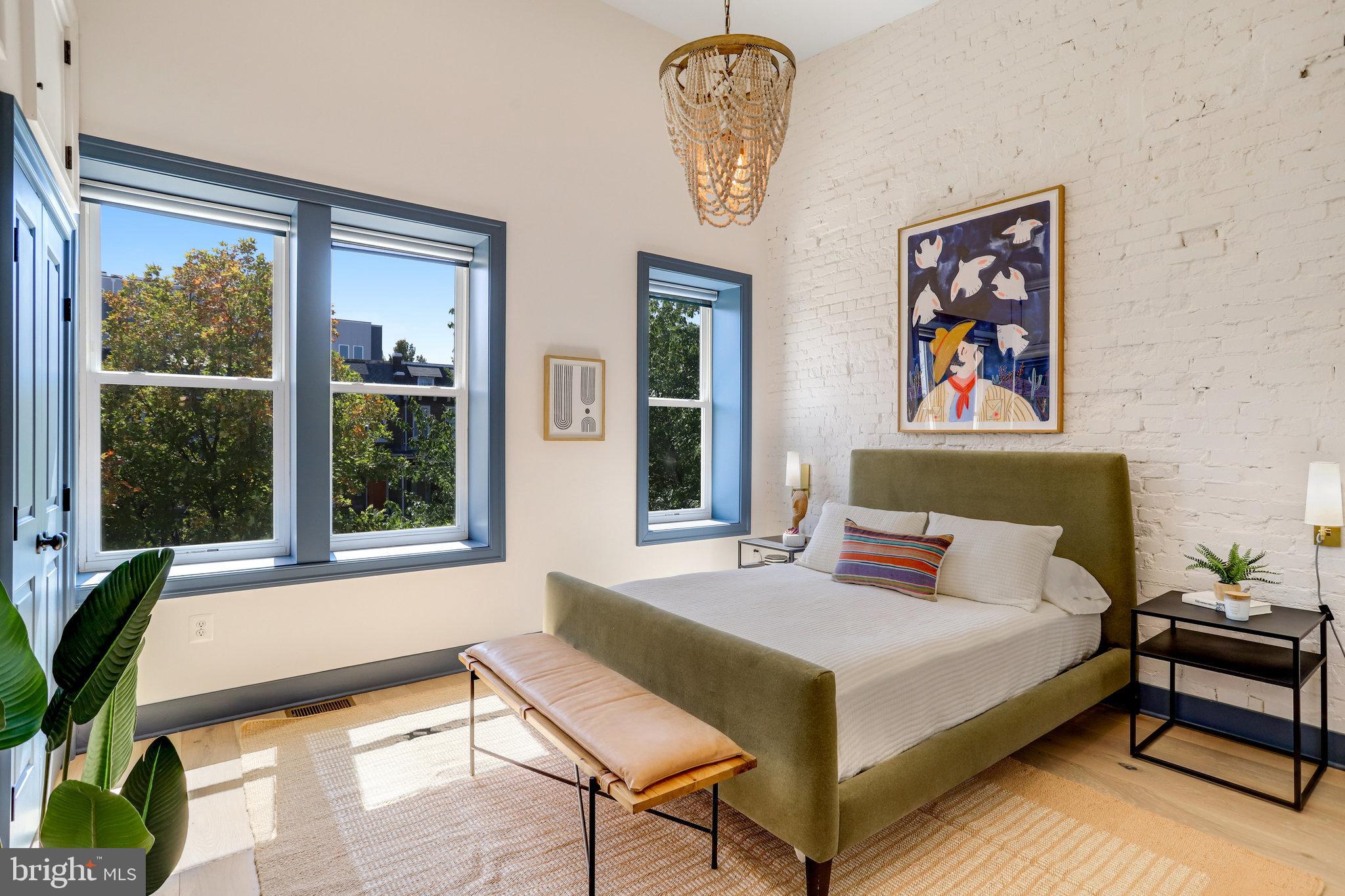 1304 E Street Northeast Washington, DC 20002 - Photo 13 of 42 a bedroom with a bed and a window