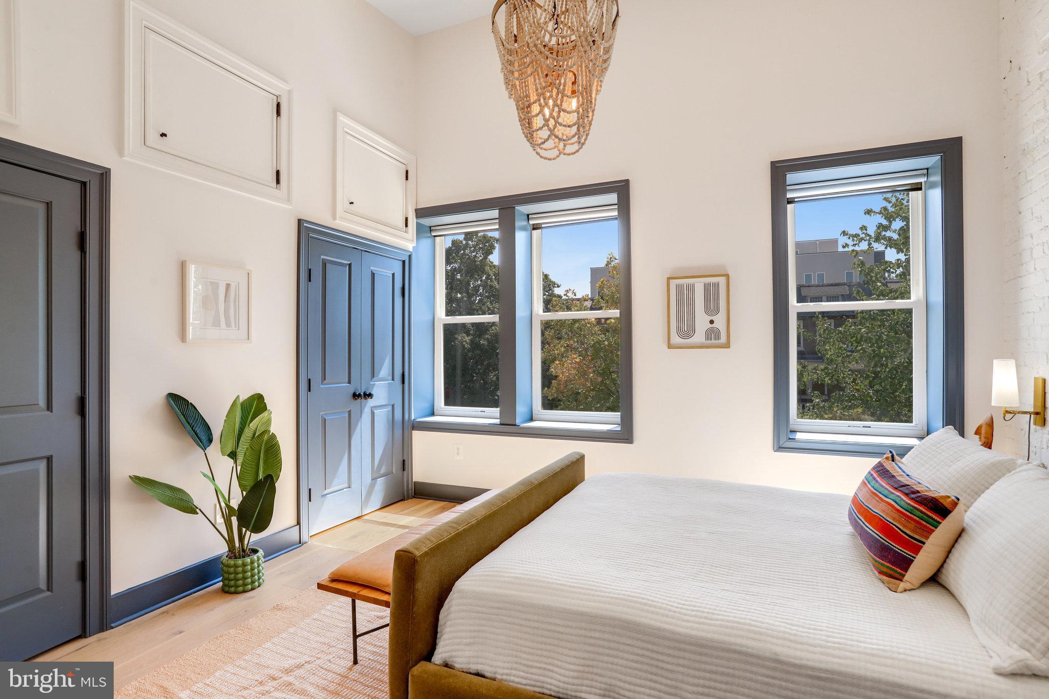1304 E Street Northeast Washington, DC 20002 - Photo 14 of 42 a bedroom with furniture and a large window