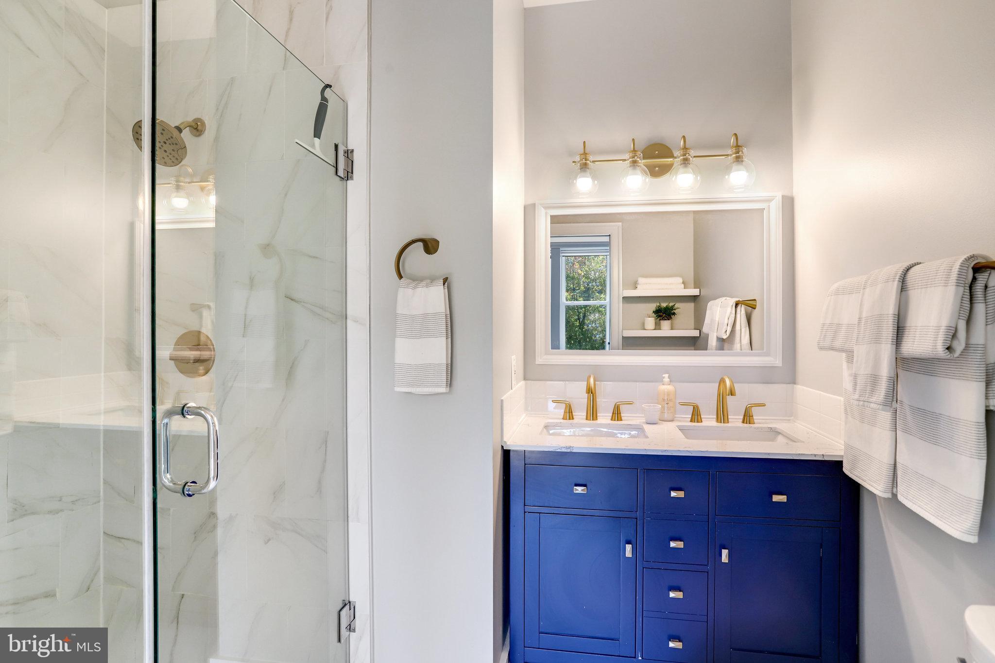 1304 E Street Northeast Washington, DC 20002 - Photo 17 of 42 a bathroom with a sink vanity and a mirror
