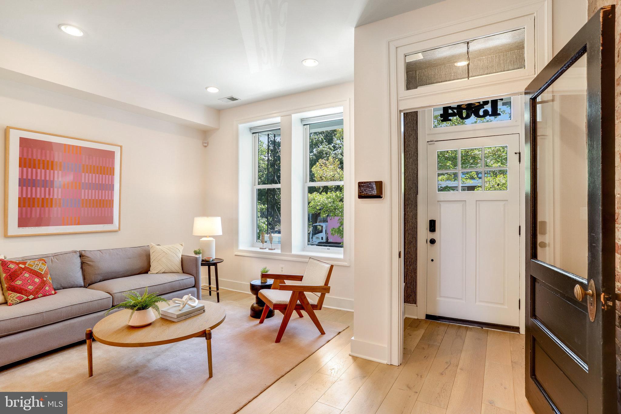 1304 E Street Northeast Washington, DC 20002 - Photo 2 of 42 a living room with furniture and a window