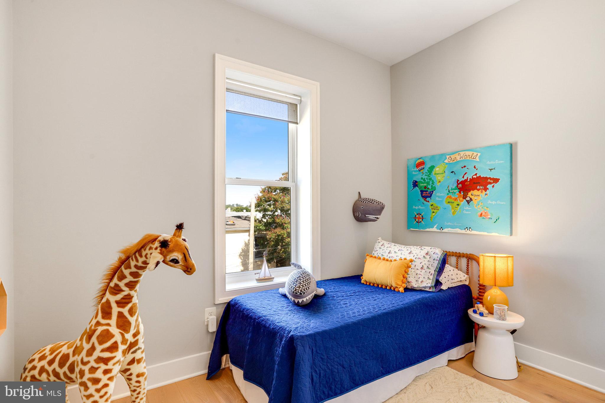 1304 E Street Northeast Washington, DC 20002 - Photo 22 of 42 a living room with furniture and a couch