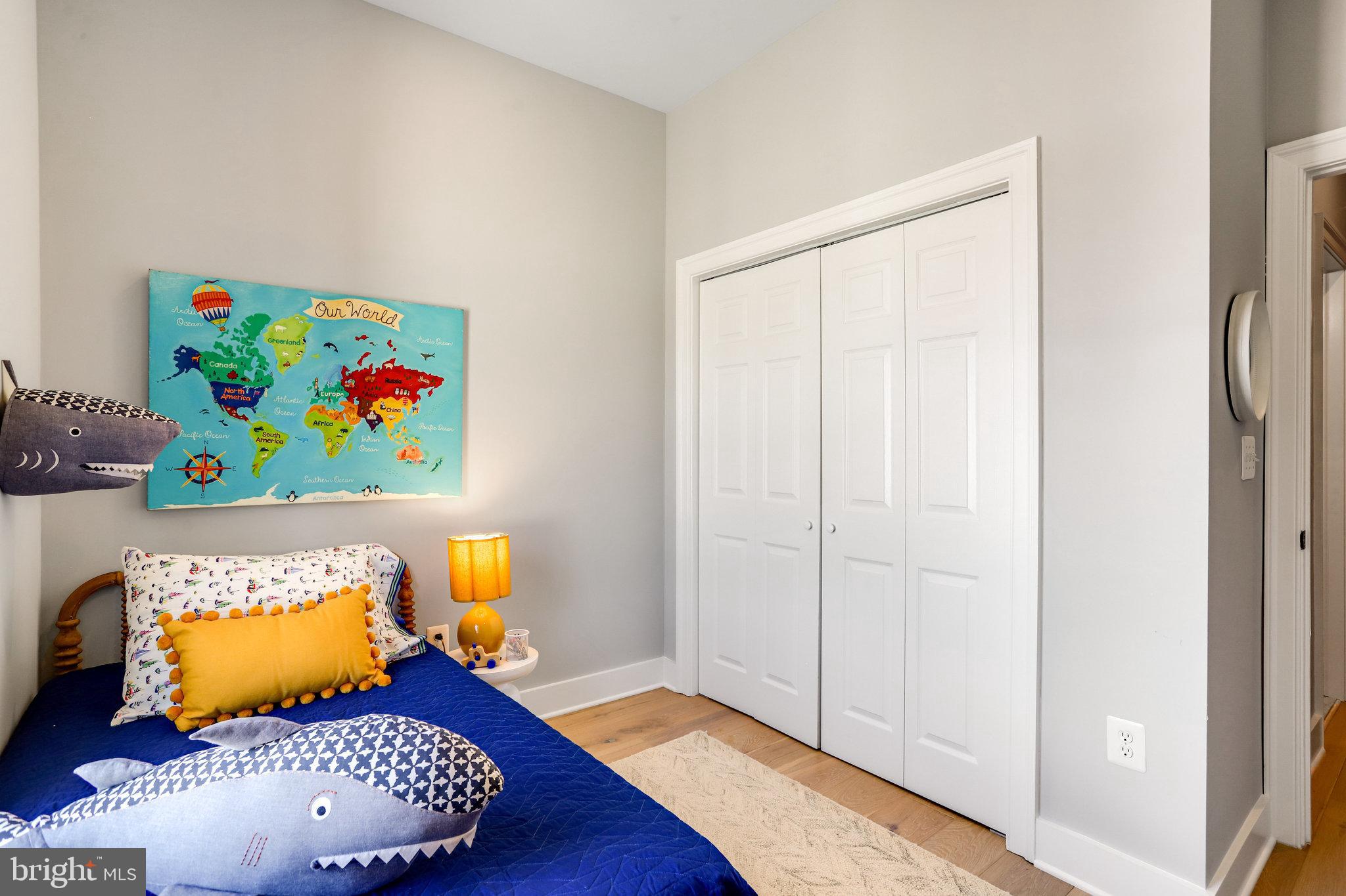 1304 E Street Northeast Washington, DC 20002 - Photo 23 of 42 a living room with furniture and wooden floor