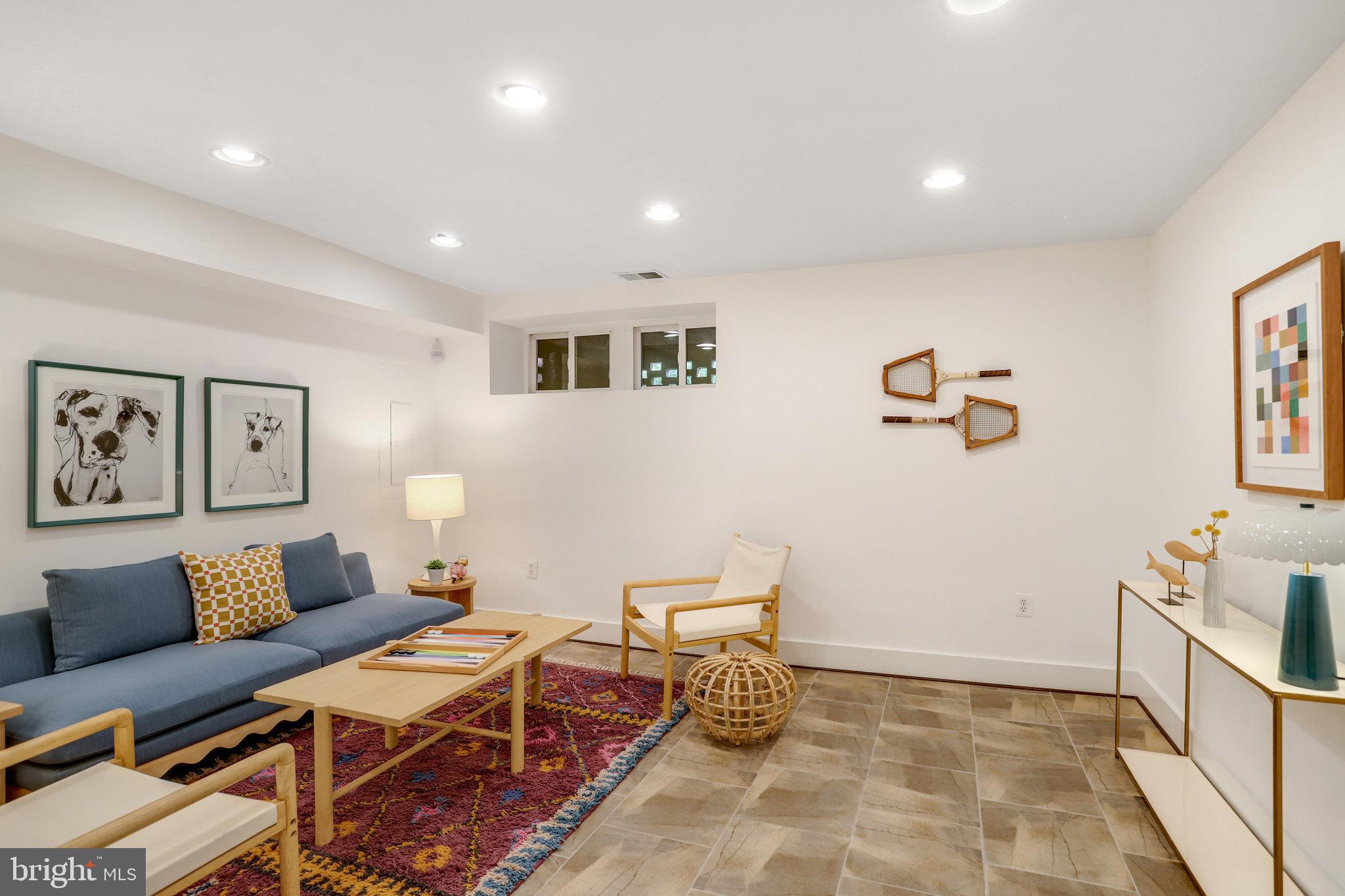 1304 E Street Northeast Washington, DC 20002 - Photo 26 of 42 a living room with furniture and a couch
