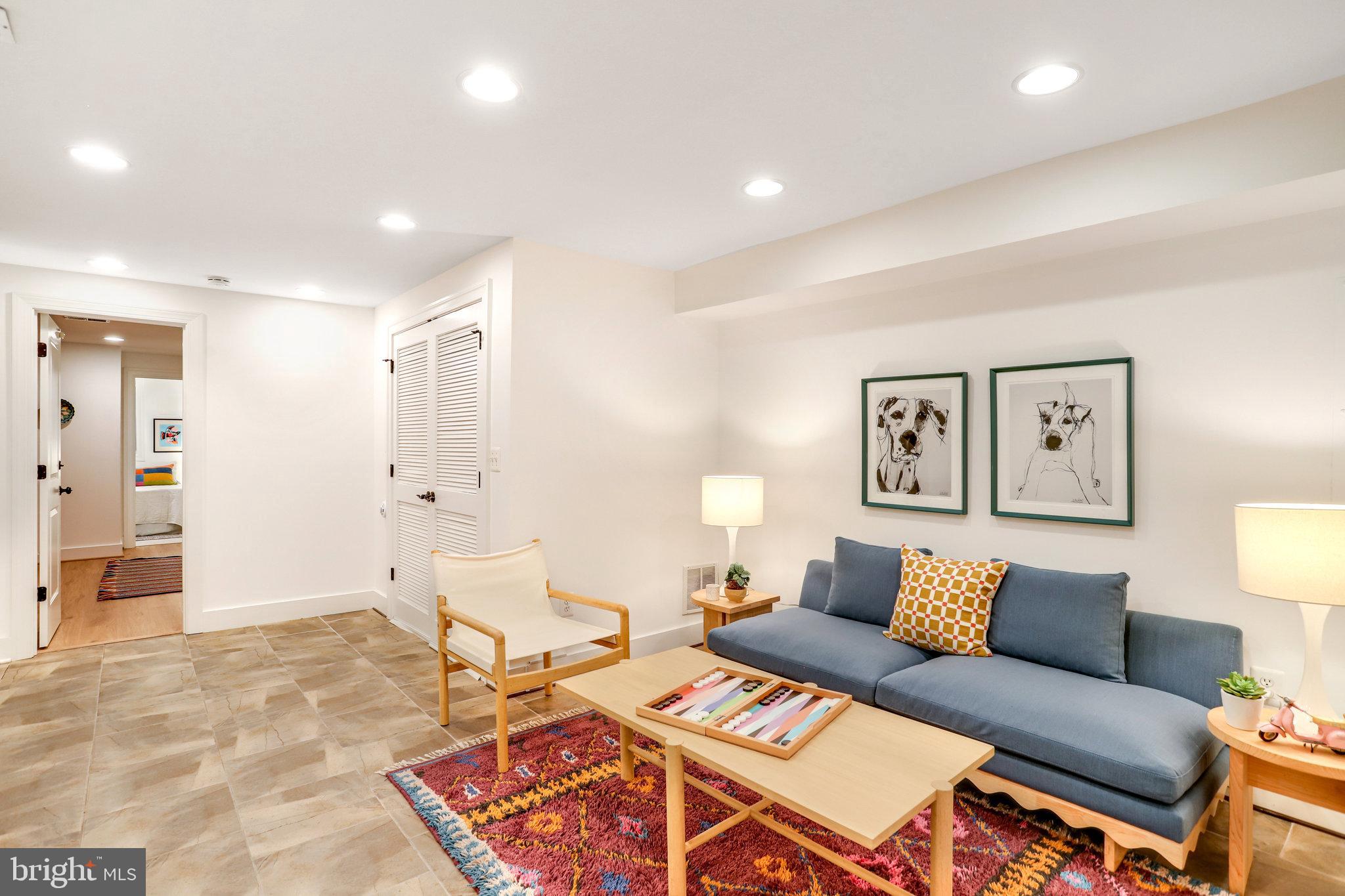 1304 E Street Northeast Washington, DC 20002 - Photo 27 of 42 a living room with furniture and a table