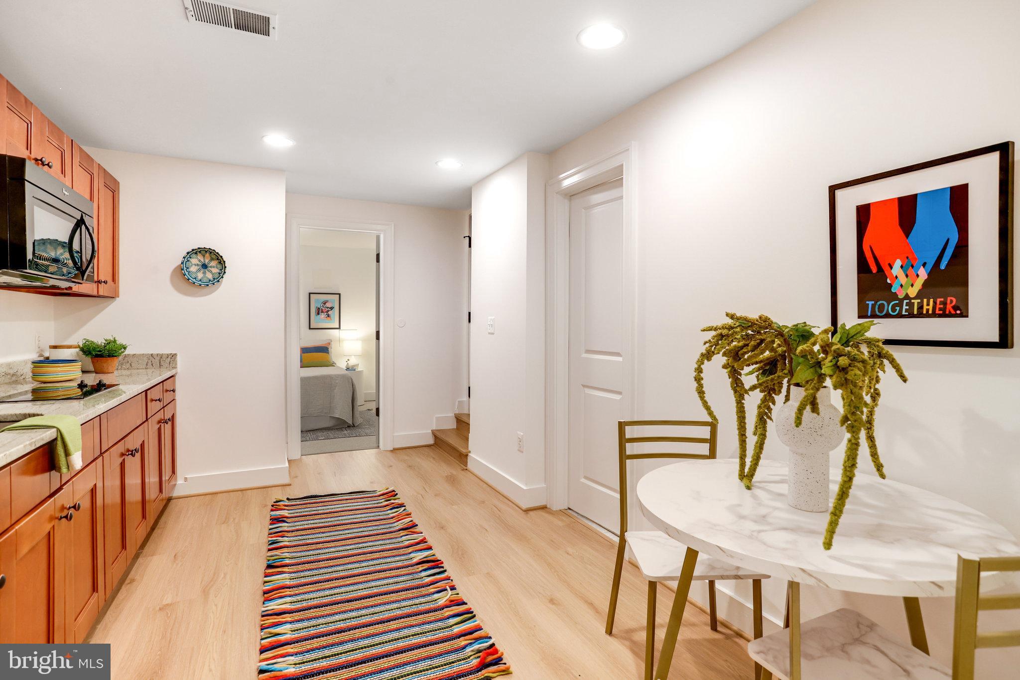 1304 E Street Northeast Washington, DC 20002 - Photo 28 of 42 a view of a hallway with furniture and wooden floor