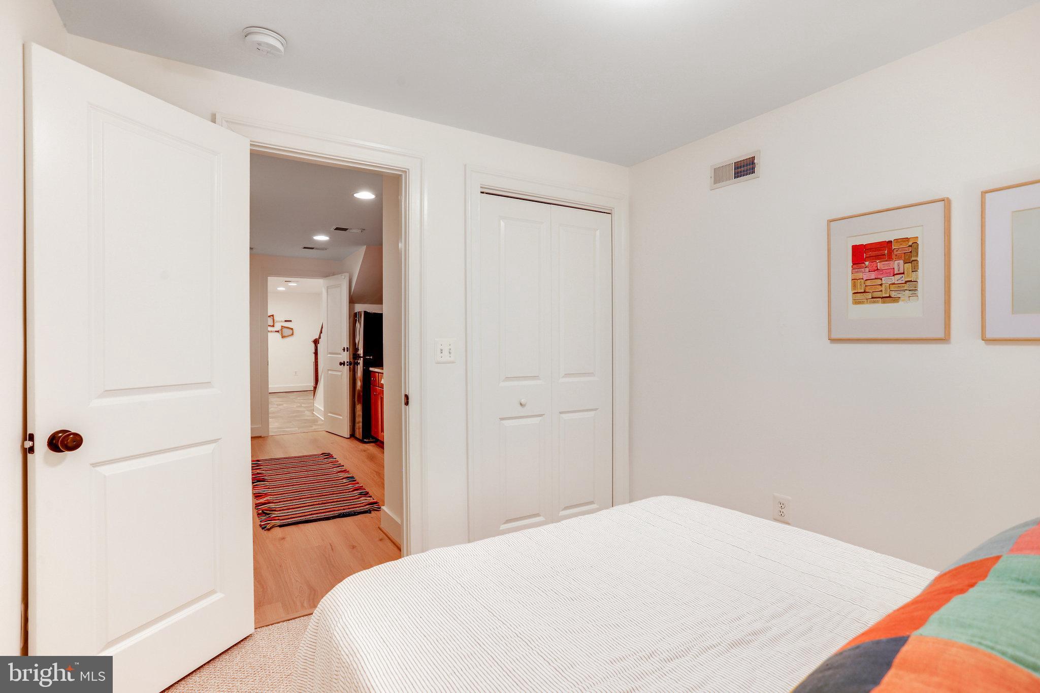 1304 E Street Northeast Washington, DC 20002 - Photo 31 of 42 a bedroom with a bed and a view of bathroom