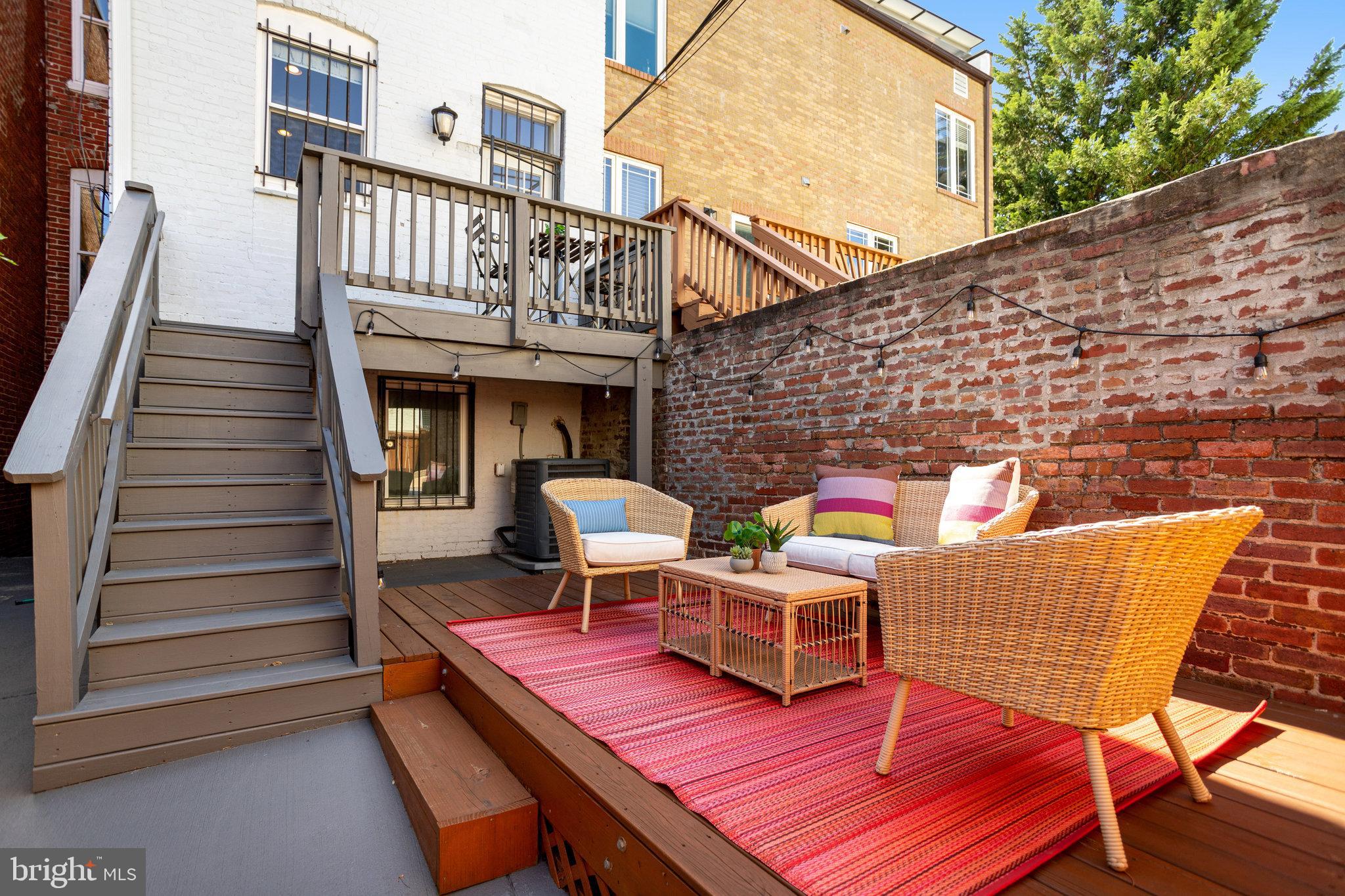 1304 E Street Northeast Washington, DC 20002 - Photo 35 of 42 a view of a patio with a table and chairs
