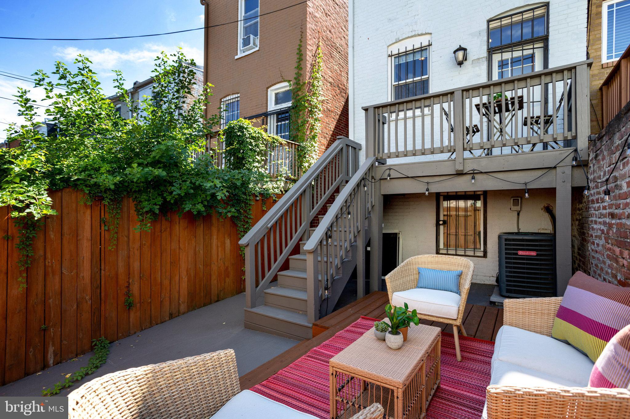 1304 E Street Northeast Washington, DC 20002 - Photo 36 of 42 a balcony with furniture and a potted plant
