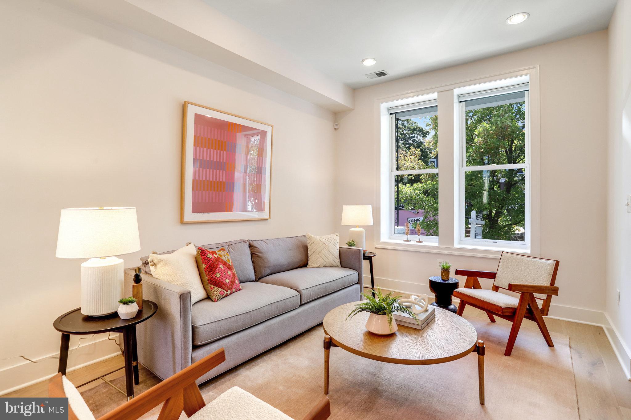 1304 E Street Northeast Washington, DC 20002 - Photo 4 of 42 a living room with furniture and a large window