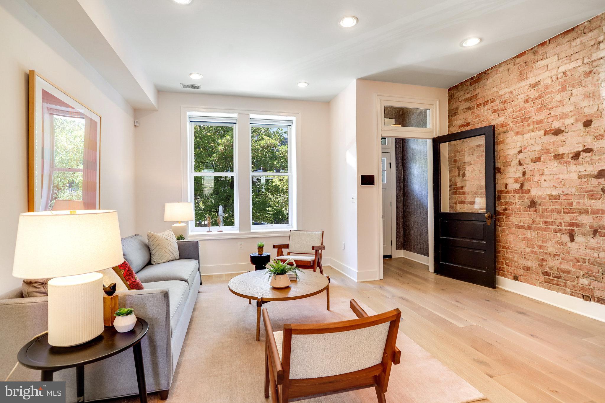 1304 E Street Northeast Washington, DC 20002 - Photo 5 of 42 a living room with furniture and a window