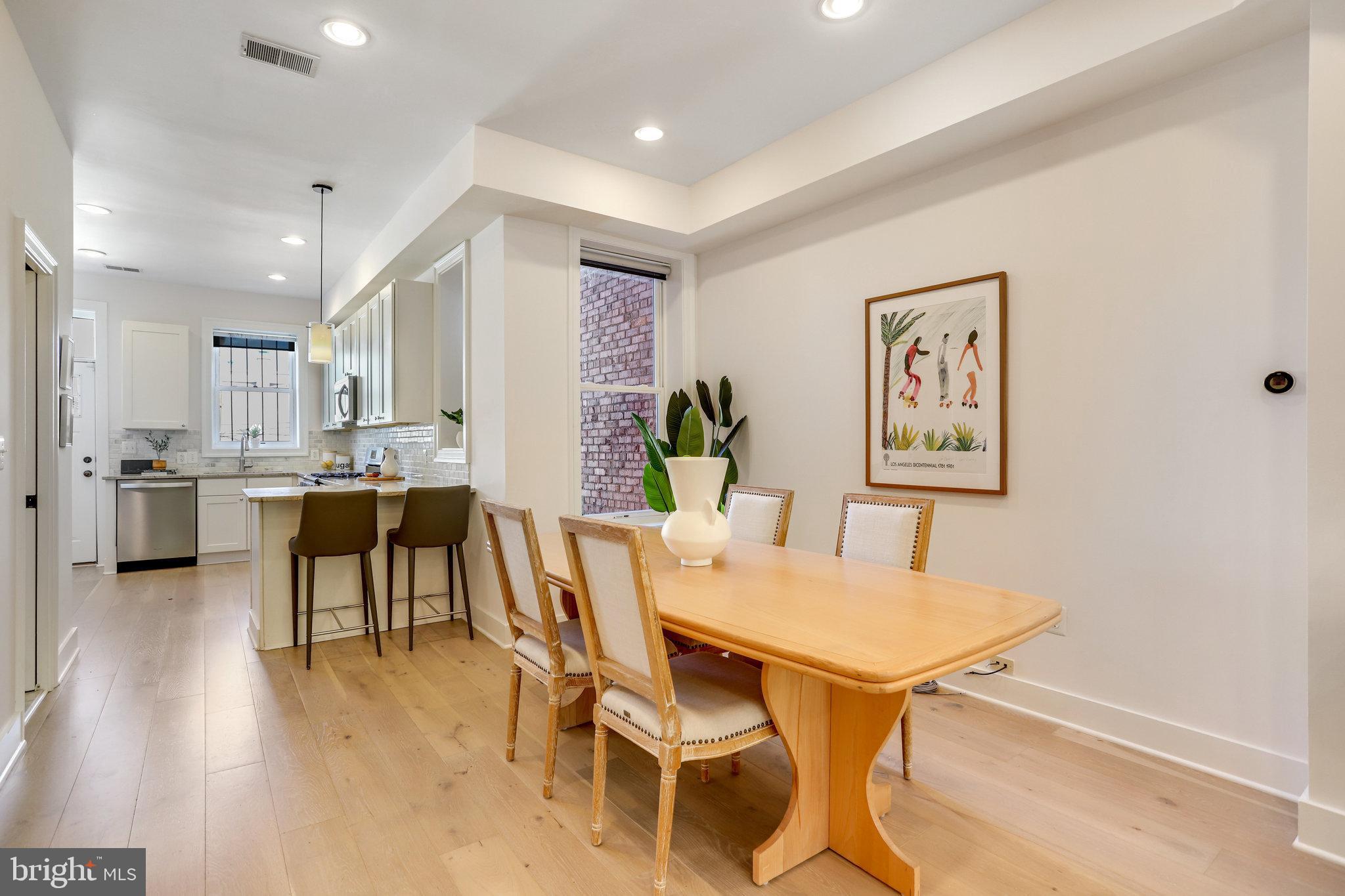 1304 E Street Northeast Washington, DC 20002 - Photo 7 of 42 a view of a dining room with furniture and wooden floor