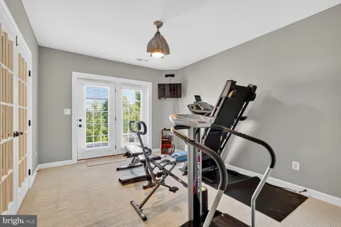 a view of a livingroom with furniture and windows