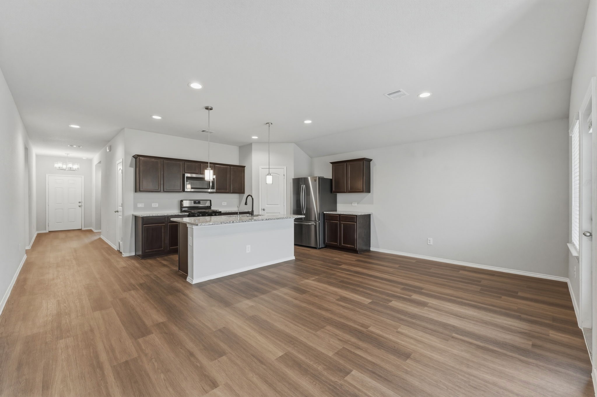 2407 Staverton Cir Spring Spring, TX 77373 - Photo 11 of 41 a view of kitchen with kitchen island granite countertop stainless steel appliances refrigerator sink and cabinets
