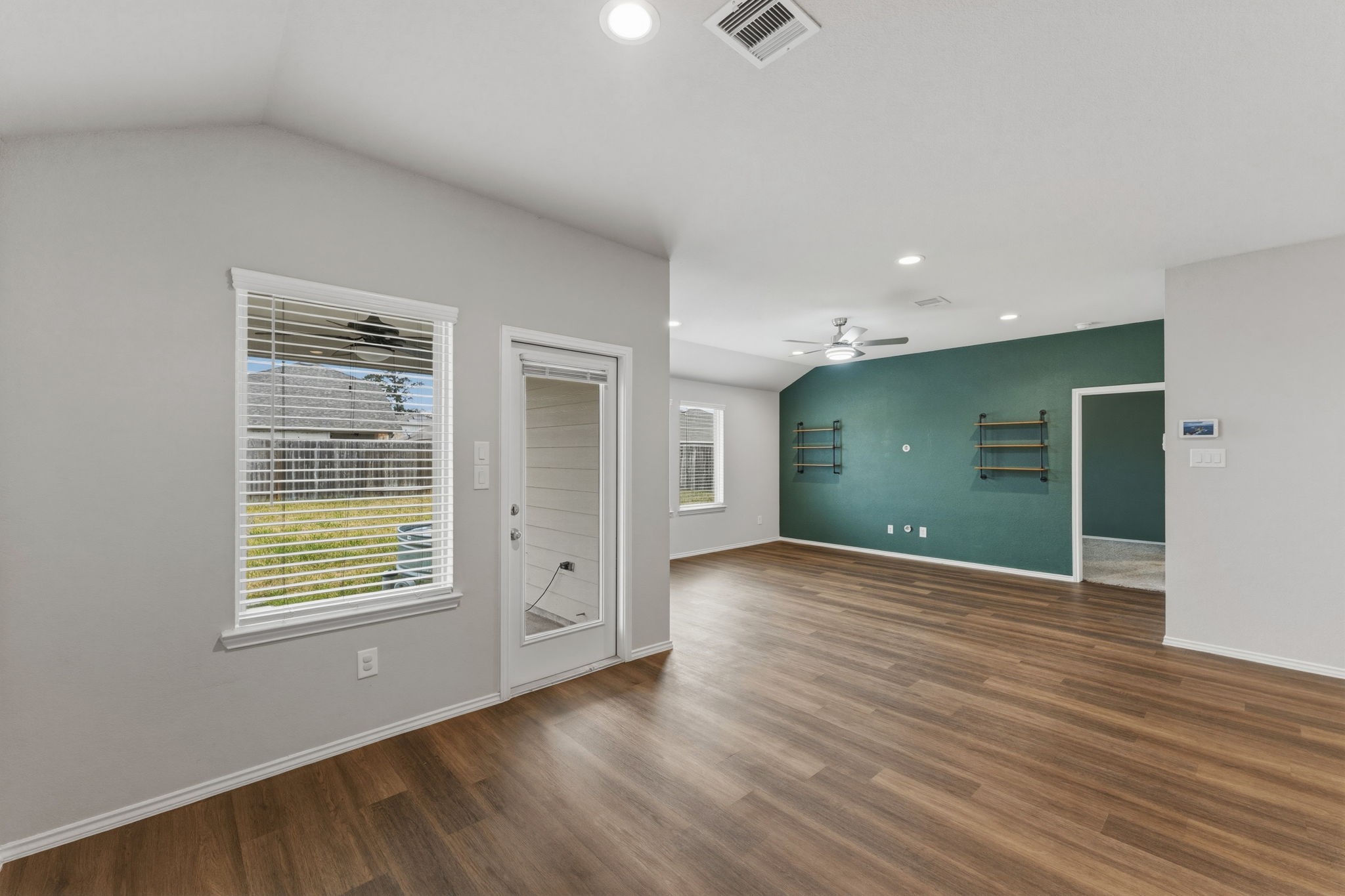2407 Staverton Cir Spring Spring, TX 77373 - Photo 17 of 41 a view of an empty room with wooden floor and a window