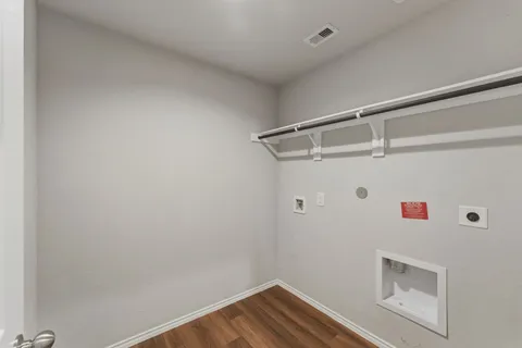 a view of storage and utility room with washer and dryer