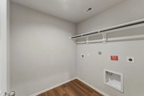 a view of storage and utility room with washer and dryer
