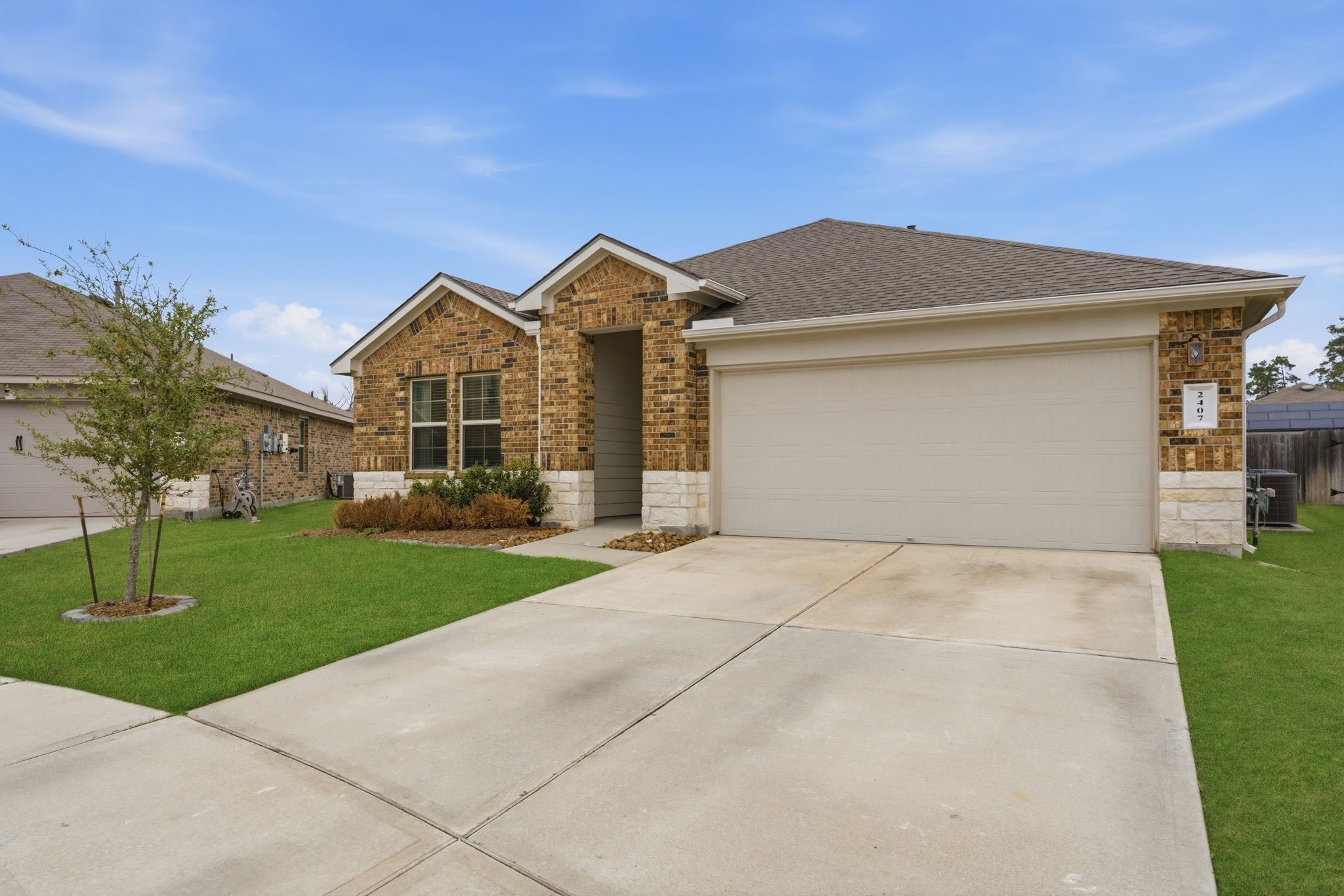 2407 Staverton Cir Spring Spring, TX 77373 - Photo 3 of 41 a front view of a house with a yard and garage