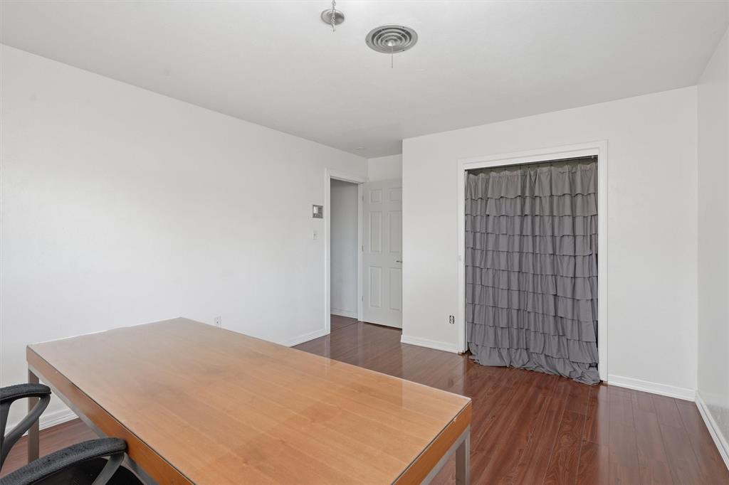 4105 Springbranch Drive Benbrook, TX 76116 - Photo 25 of 30 an empty room with wooden floor