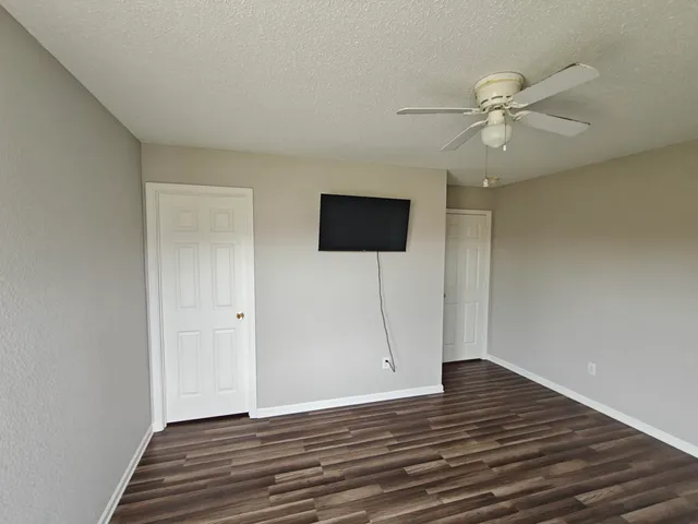 a backyard of a house with table and chairs